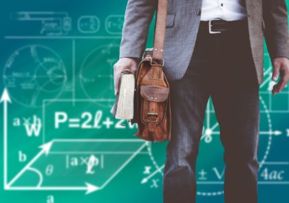 Kuvituskuva, osittainen miehen vartalo kirja kädessä