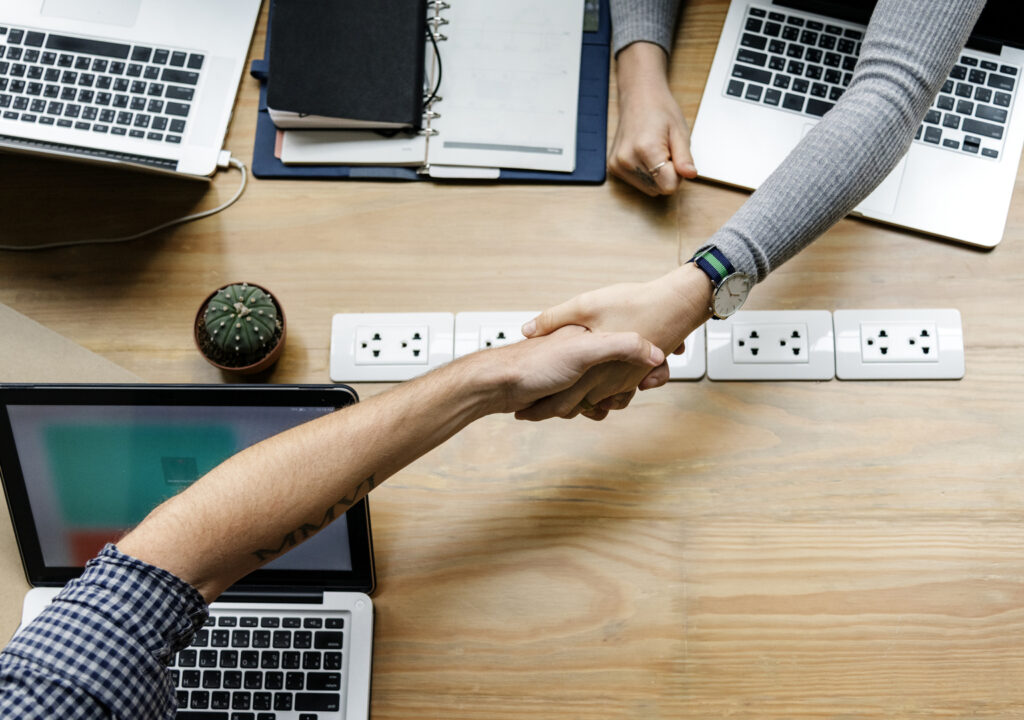 Two people shaking hands.