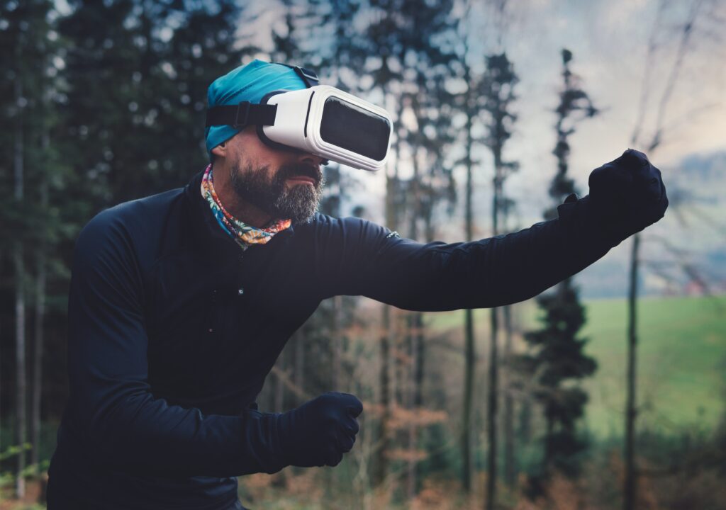 A person using VR headset in nature.