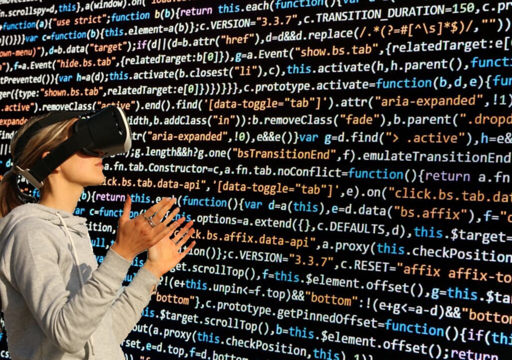 Woman wearing a virtual reality glasses facing a wall of code